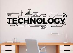 a wall decal with the word technology on it in black and white, above a desk