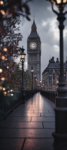 the big ben clock tower towering over the city of london, england at christmas time