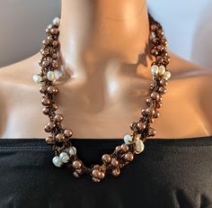 Elevate your style with this chunky bronze and freshwater pearl crochet necklace. Handcrafted with meticulous attention to detail, this unique statement piece marries the rustic charm of bronze with the elegance of freshwater pearls. Perfect for any occasion, this necklace will add a touch of sophistication to your outfit. Whether you're dressing up for a special event or adding a pop of elegance to your everyday wear, this necklace is a must-have accessory. Order now and make a statement with t Pearl Crochet, Beautiful Crochet, Necklace Handmade, Rustic Charm, Handmade Necklaces, Special Event, Fresh Water, Freshwater Pearls, Special Events