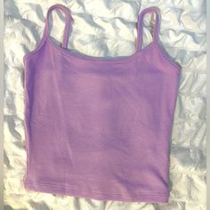 Lavender Spaghetti Strap Crop Top. Size Xs. Never Worn, Perfect Condition! No Holes, Stains, Etc. Super Soft And Comfy Material, As Well As Stretchy So It Can Fit Larger Sizes As Well. ****Fast Shipping! Purple Spaghetti Strap Tops For Summer, Purple Spaghetti Straps Top For Summer, Purple Spaghetti Straps Tank Top For Spring, Trendy Purple Spaghetti Strap Top, Trendy Purple Top With Spaghetti Straps, Casual Purple Spaghetti Strap Top, Fitted Purple Cotton Camisole, Purple Cami Tank Top For Spring, Purple Sleeveless Cotton Camisole