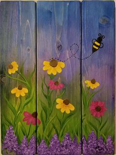 painted wooden boards with flowers and a bee