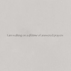 the words i am walking on a line of answered prayers are in black and white