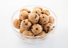 a glass bowl filled with chocolate chip cookies