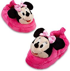 two minnie mouse slippers are shown on a white background, one is pink and the other is black