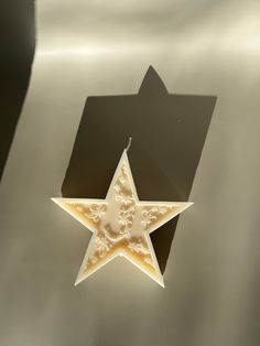 a white star shaped object sitting on top of a table