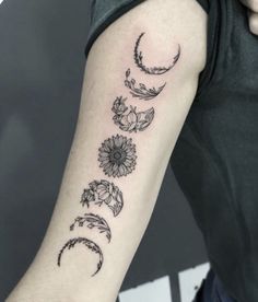 a woman's arm with three phases of the moon and sun tattoo on it