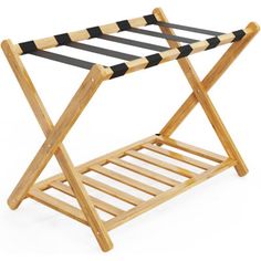 a wooden folding table with black and white stripes on the top, against a white background