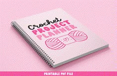 a pink notebook with the words crochet project planner on it next to a ball of yarn