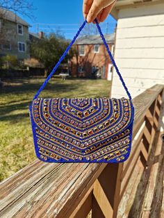 Handmade Blue Clutch Purse, Beaded Clutch Purse, Party Golden Purse, Blue Clutch, Glass Beaded Bag, Blue Beaded Handbag, Blue Box Bag, Blue Crossbody Bag The purse clutch is handmade and adorned with rhinestones and bead embroidery. This purse is stylish, flashy, and has a dazzled look. These purses/bags are for wedding functions, parties, and formal events, or you can use them as casual. These are fancy small bags ideal for money, cards, and makeup touchup kits. The bag has a single compartment Traditional Beaded Bag For Party, Beaded Festival Clutch Bag, Beaded Clutch Bags For Festivals, Festival Beaded Clutch Bag, Beaded Pouch Shoulder Bag For Festive Occasions, Festive Beaded Pouch Shoulder Bag, Blue Bohemian Pouch Clutch, Rectangular Blue Beaded Clutch, Blue Beaded Evening Bag