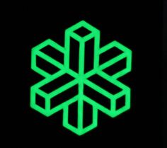 a green snowflake is glowing in the dark