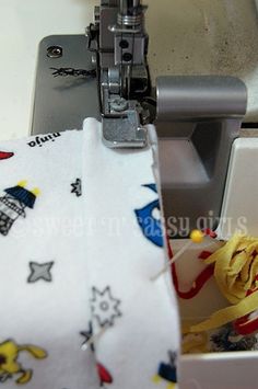 the sewing machine is working on the fabric that has been sewned into it