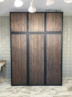 three wooden doors in a room with white walls and marble flooring on the side