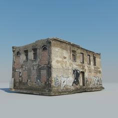 an old brick building with graffiti on it's walls and windows, sitting in the middle of a desert