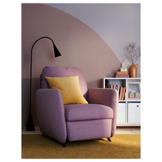 a living room with a purple chair and yellow pillows on the floor next to a book shelf