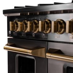 an oven with many knobs and brass handles