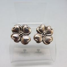 These lovely dogwood blossom vintage earrings are sterling screw back style. They measure 1 inch in diameter. They are in Excellent condition and signed, Sterling on the back. We will send these to you in a lovely gift box for safe storage or easy gift giving. If you like vintage costume jewelry, old silver, bolo ties and more, please check out my shop, www.etsy.com/shop/PANDPF Classic Flower Earrings Gift, Classic Flower Shaped Earrings For Gift, Vintage Flower Jewelry For Collectors, Vintage Flower Jewelry Collectible, Vintage Collectible Flower Jewelry, Vintage Nickel-free Clip-on Earrings For Anniversary, Silver Vintage Flower Earrings For Formal Occasions, Vintage Clip-on Flower Earrings, Classic Silver Flower Earrings For Gift