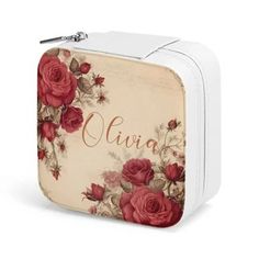 a white lunch box with red roses and the word ava on it's side