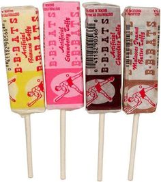 four candy lollipops are lined up on top of each other