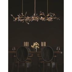 a dining room table with chairs and a chandelier hanging from it's ceiling