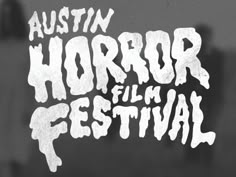 the logo for an upcoming horror film festival, with white lettering on black and gray background