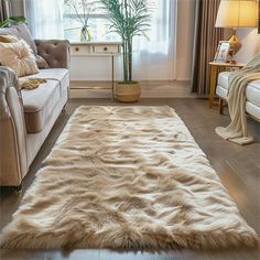 a living room filled with furniture and a large rug