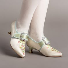 Step back in time with the delicious Primrose 18th century shoes. This authentic embroidered satin design has been recreated in collaboration with The Bata Shoe Museum, capturing the look and feel of the original shoes from 1770s-1790s. Made on the Dunmore last and 2 inch / 5 cm heel, you can be sure that style doesn't mean sacrificing comfort. The Primrose 18th century shoes are part of the "In Bloom" collection developed with the Bata Shoe Museum. Every pair of Primroses sold benefits this imp 1800 Shoes Women, Regency Era Shoes, Colonial Shoes, Marie Antoinette Dress 18th Century, 1800s Shoes, 1700s Shoes Women, 1870s Shoes, 19th Century Shoes, Regency Shoes