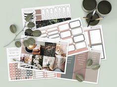 the printable planner stickers are laid out on top of each other, along with two cups of coffee