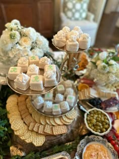 a table topped with lots of food and desserts