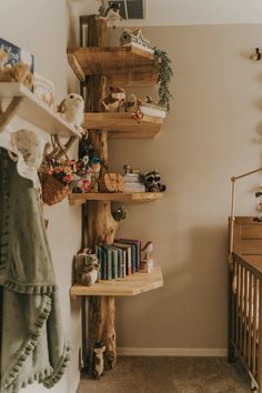 a baby's room with bookshelves and stuffed animals on the shelfs