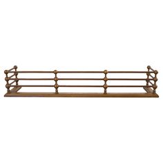 a wooden shelf with two rails on it