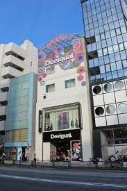 the building has many windows on it and is decorated with colorful designs, including flowers