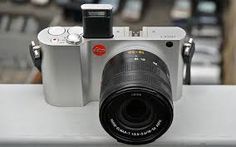 a silver camera sitting on top of a table