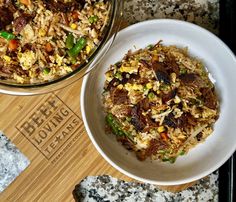 two bowls filled with food sitting on top of a counter