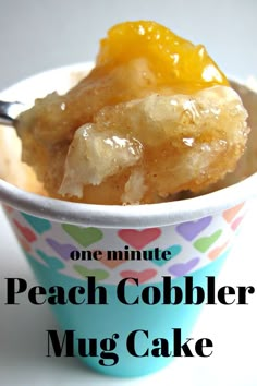 a cup filled with peach cobbler mug cake