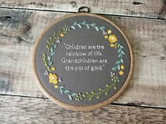 a cross stitch pattern with the words children are the rainbow of life and granddaughter are the pot of gold