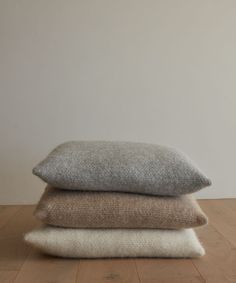 three pillows stacked on top of each other