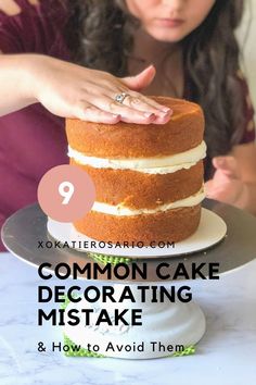 a woman is decorating a cake with white frosting