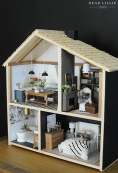 a doll house with furniture and accessories on the inside is made out of plywood