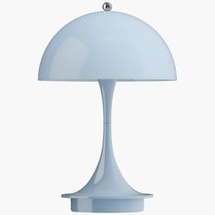 a light blue table lamp on a white background