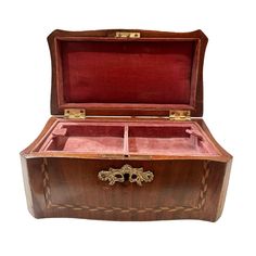 an old wooden box with two compartments and gold handles on the inside is shown against a white background