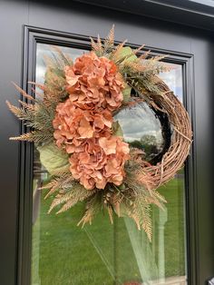 a wreath is hanging on the front door