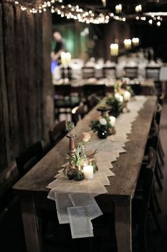 a long table with candles and flowers on it is featured in the instagram post