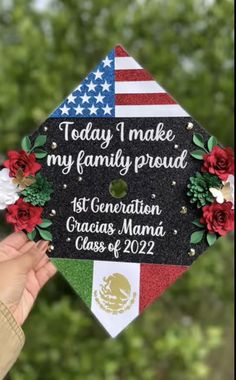 a person holding up a graduation cap with flowers on it and the words today i make my family proud