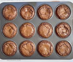 a muffin tin filled with chocolate cupcakes