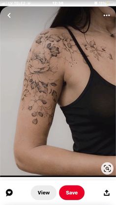 a woman's arm with flowers on it