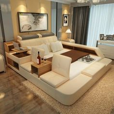 a modern living room with white leather furniture