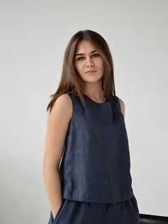 "Midnight blue sleeveless linen top. Handmade linen basic tank top. Creating this collection I was thinking, first of all, about comfort and feelings of those who would wear it. Natural high-quality softened linen, well-considered details and good quality of seams - this is exactly what will help your body to feel taken care of. For stitching parts, I never use an overlock, all internal seams are French (double). This fabric is certified Oeko-Tex Standard 100 03.0.4362. The top made of high-qual Everyday Linen Sleeveless Tank Top, Everyday Sleeveless Linen Tank Top, Sleeveless Linen Top For Everyday, Everyday Sleeveless Linen Top, Casual Blue Linen Tank Top, Summer Linen Tops In Indigo, Indigo Linen Summer Tops, Blue Linen Sleeveless Tank Top, Summer Indigo Linen Tops