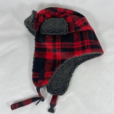 Trapper Aviator Plaid Red & Black Hat Nwot Earflaps Are 7 1/2" Long 100% Polyester Adjustable Chin Strap With Quick Release This Hat Is Adjustable And Comfortable Size: S/M, The Inner Circumference Is Approximately 22 1/4" Brand New Without A Tag Plaid Trapper Hat, Mickey Mouse Ears Hat, Tropical Trend, Mermaid Hat, Vintage Straw Hat, Packable Sun Hat, Burgundy Hat, Beige Hat, Summer Straw Hat