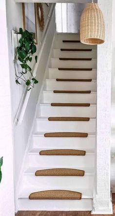 the stairs are painted white and have brown treads