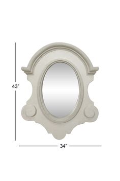 a white mirror sitting on top of a table